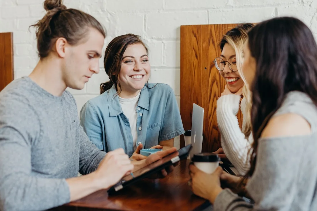 Two people having a relaxed English conversation over coffee
