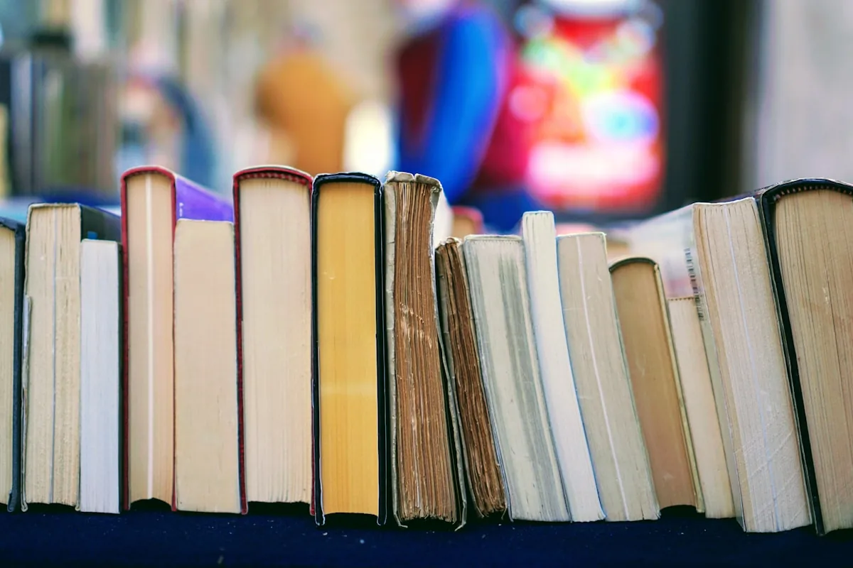 Open English books and vocabulary notes on a wooden table
